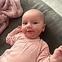 Ariane participe au concours pour gagner de l'argent avec cette photo : baby, blanket, cheeks, couch, cozy, cute, face, furniture, hand, head, indoor, infant, person, pink_onesie, portrait, relaxing, skin, smile, soft_texture, young_child