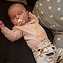 baby, child, comfort, couch, cozy, cute, home, indoor, infant, lying_down, pacifier, patterned_clothing, peaceful, pillow, relaxing, rest, sleeping, small_person, soft_lighting, stars