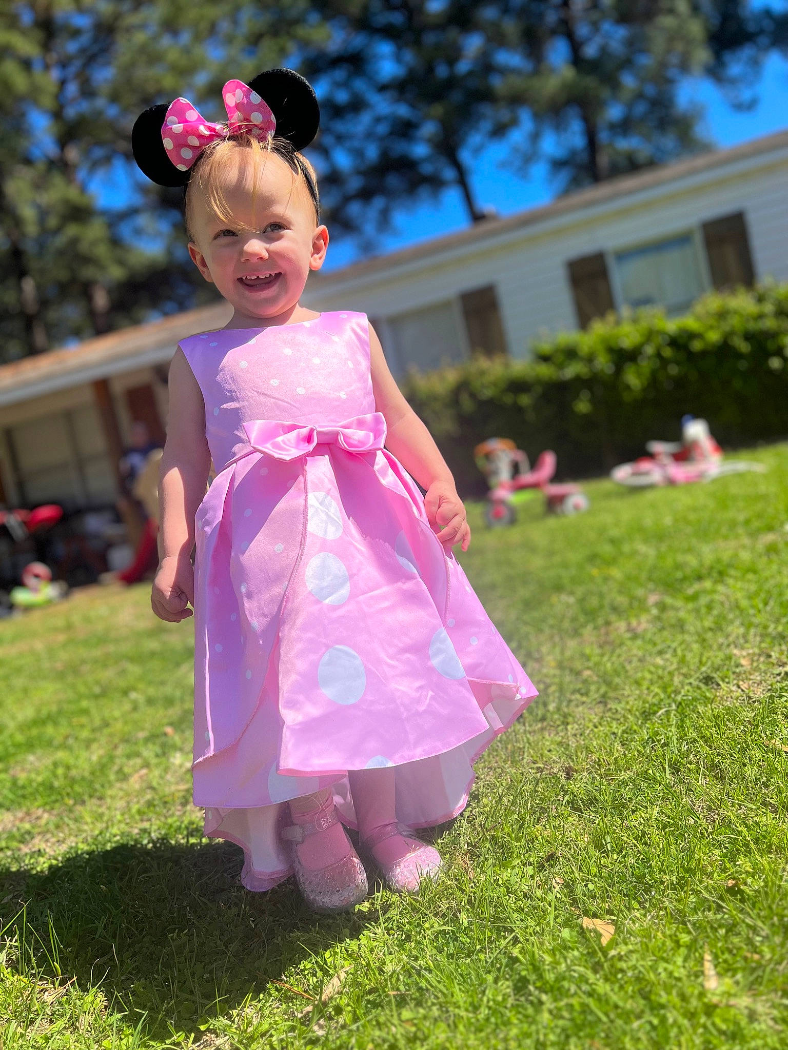 Aliyah Weaver is registered to the contest to win money with this photo: baby_toddler_clothing, child, dress, eye, fun, grass, grassland, happy, headgear, joy, lawn, leisure, magenta, people_in_nature, person, pink, plant, purple, sky, smile