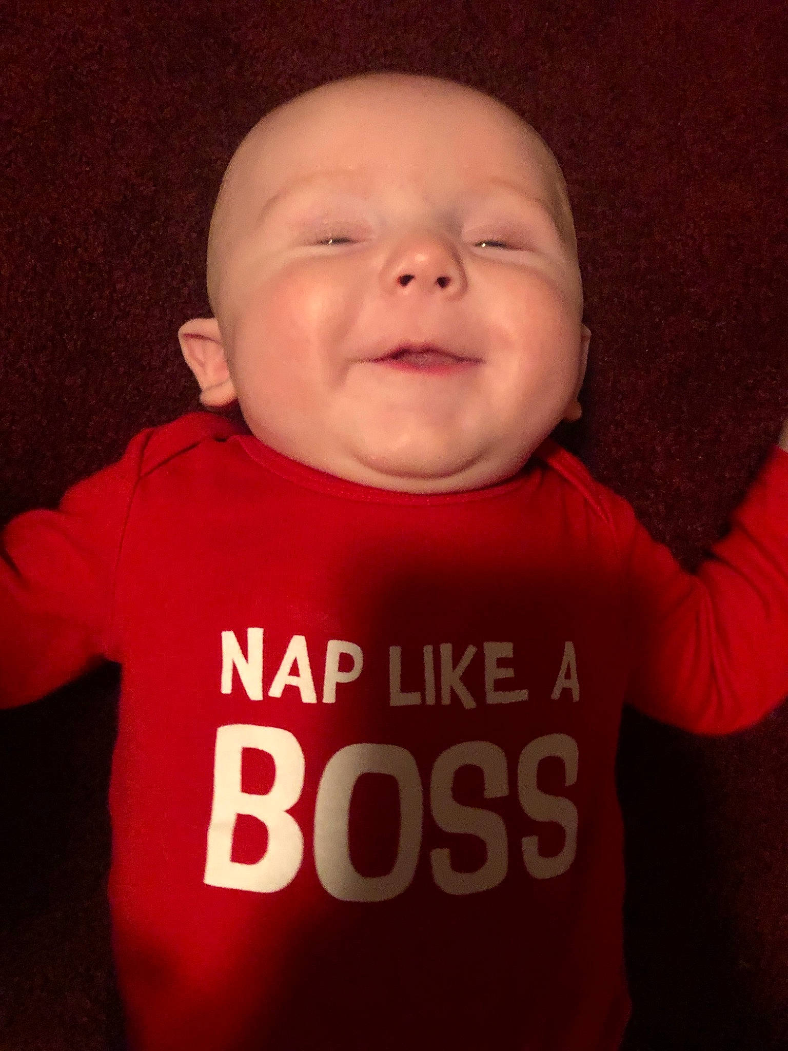 Nikolas is registered to the contest to win money with this photo: baby, baby_making_funny_faces, cheek, child, chin, cool, face, facial_expression, forehead, fun, head, laugh, lip, mouth, person, red, skin, sleeve, smile, t_shirt