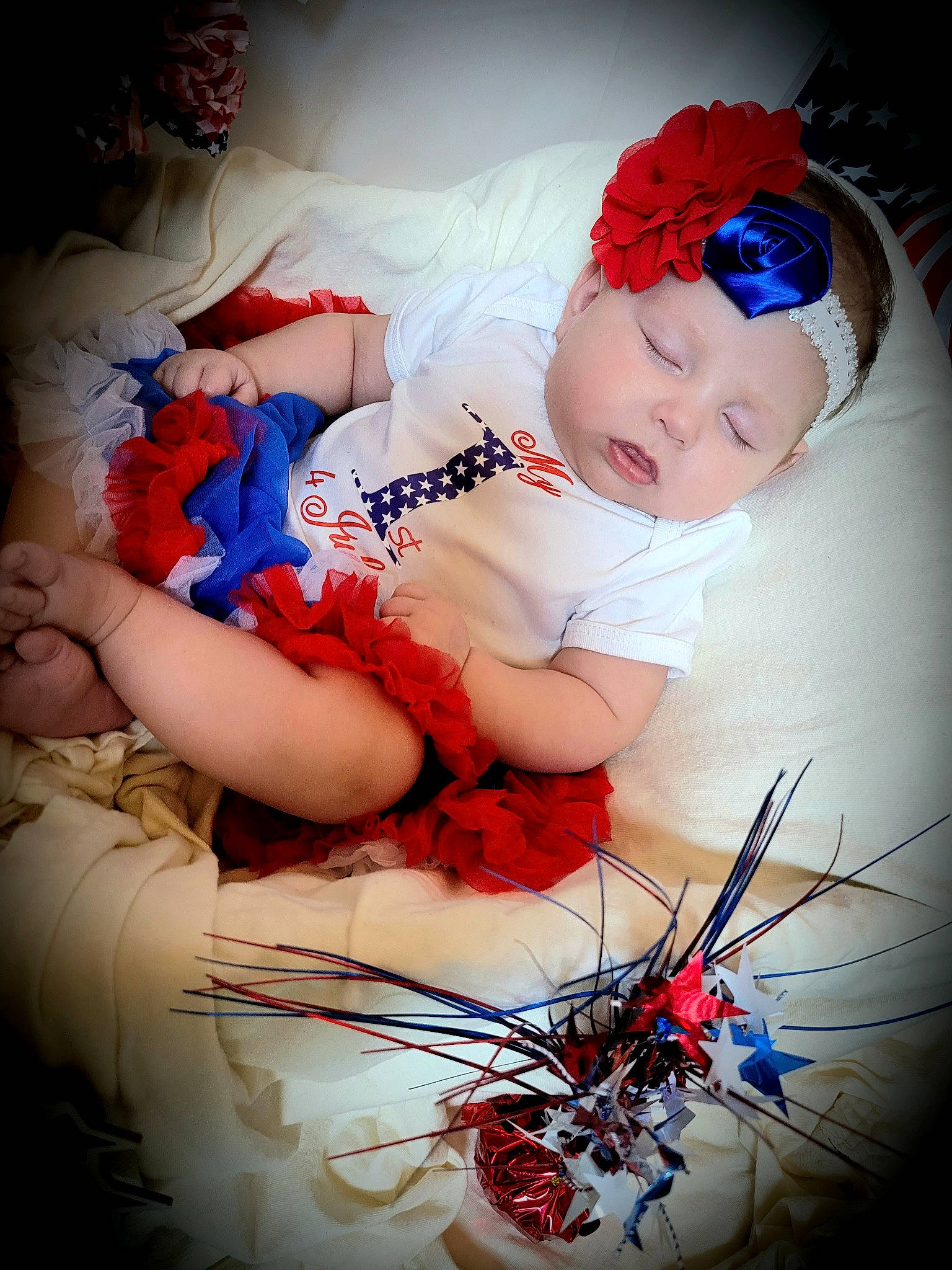 Hayley is registered to the contest to win money with this photo: arm, baby, baby_toddler_clothing, blue, cool, eye, finger, flash_photography, hand, happy, hat, headgear, headwear, human_body, mouth, person, photograph, red, skin, smile