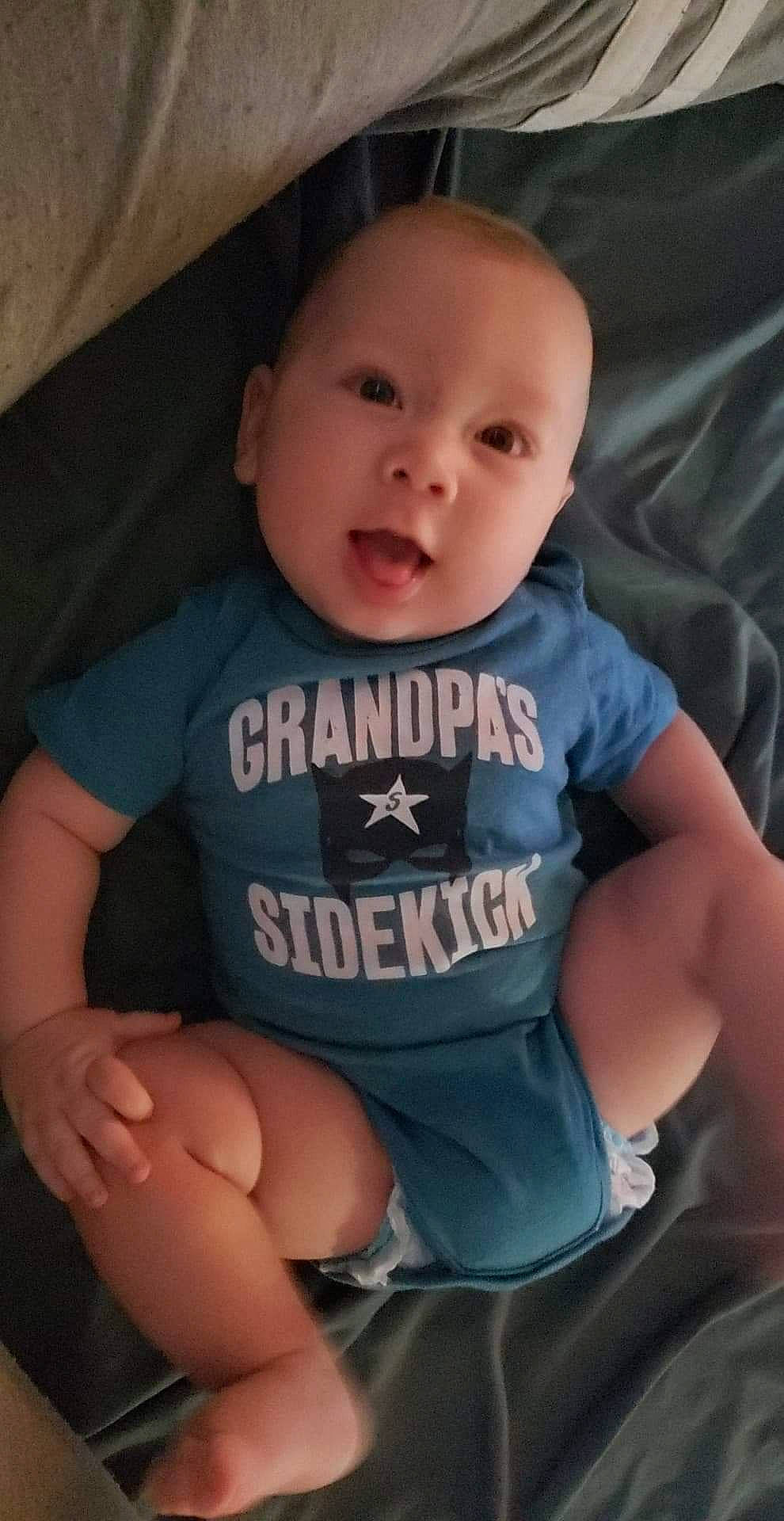 Caleb is registered to the contest to win money with this photo: abdomen, arm, boy, cheek, child, chin, cool, day, eye, finger, hand, head, infant, leg, mouth, person, product, sitting, skin, smile