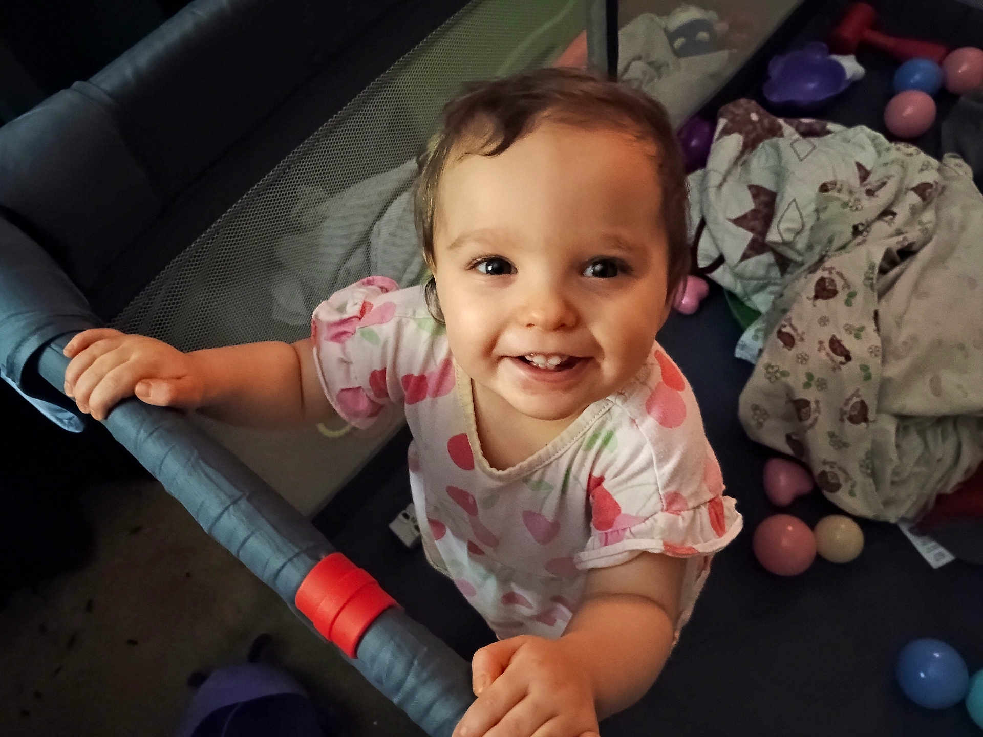 Riley joined the competition — help win amazing prizes! toddler, child, smiling, playpen, balls, blanket, toy, indoors, happy, cute, face, person, clothing, baby, hand, play, young, infant, childhood, expression