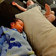 Deacon joined the competition — help win amazing prizes! baby, child, sleeping, blanket, couch, pillow, foot, hand, indoors, relaxing, cozy, rest, infant, furniture, person, home, soft, peaceful, nap, covered