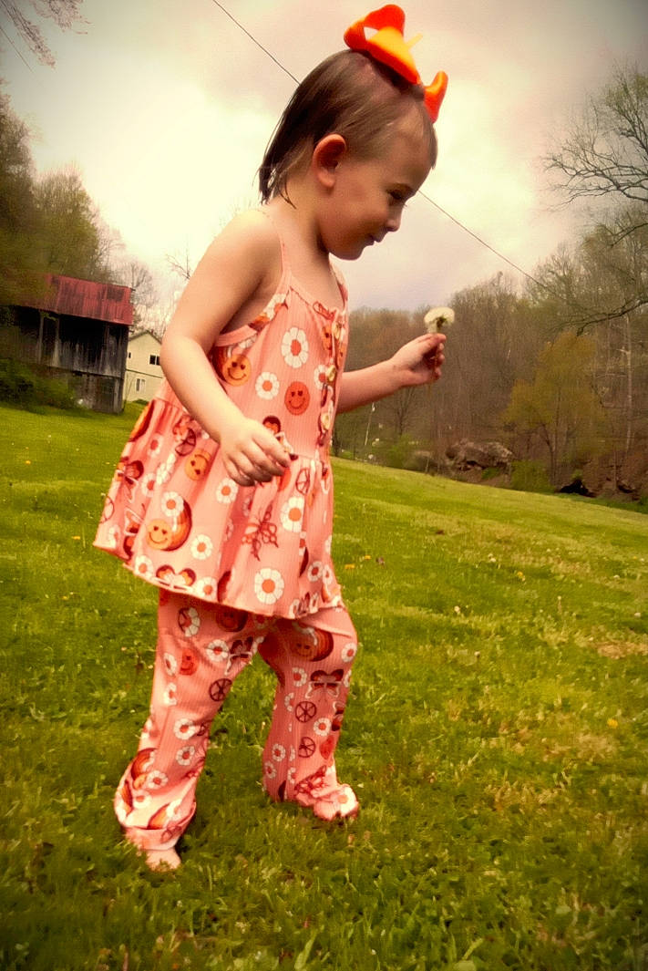 Addley is registered to the contest to win money with this photo: baby, child, flash_photography, fun, gesture, grass, grass_family, grassland, happy, leisure, meadow, pattern, people_in_nature, person, plant, prairie, sky, sleeve, sunlight, toddler