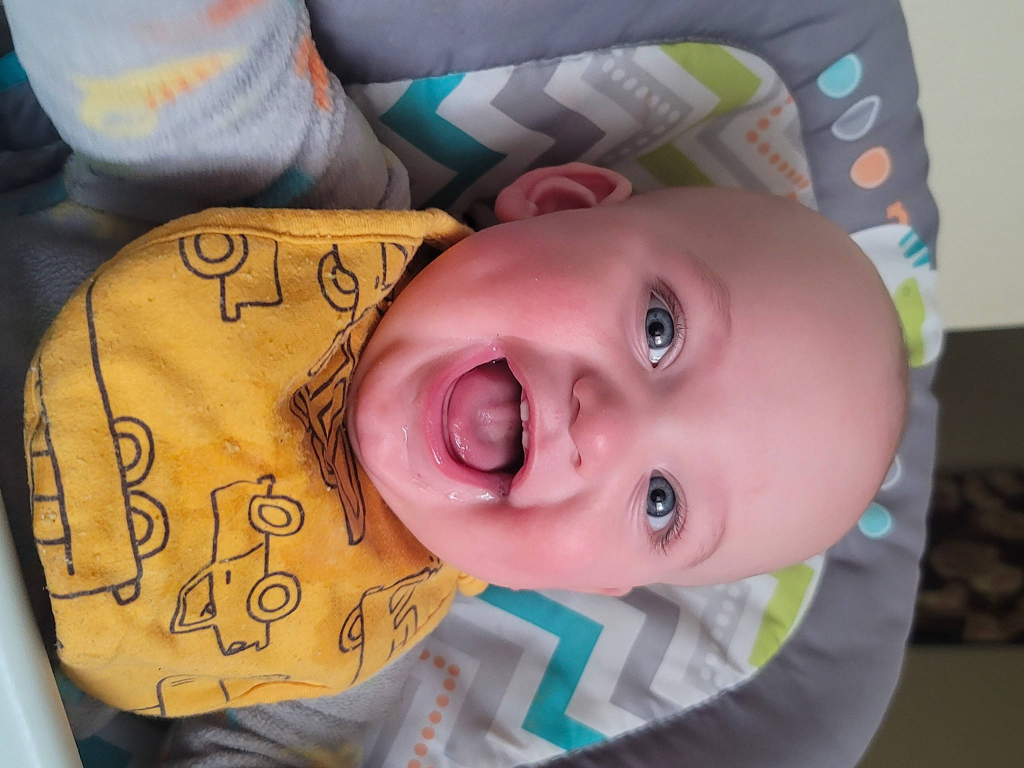 Travis is registered to the contest to win money with this photo: baby, baby_toddler_clothing, cheek, eye, eyebrow, eyelash, face, facial_expression, finger, forehead, happy, head, headgear, iris, lip, mouth, nose, person, pink, skin