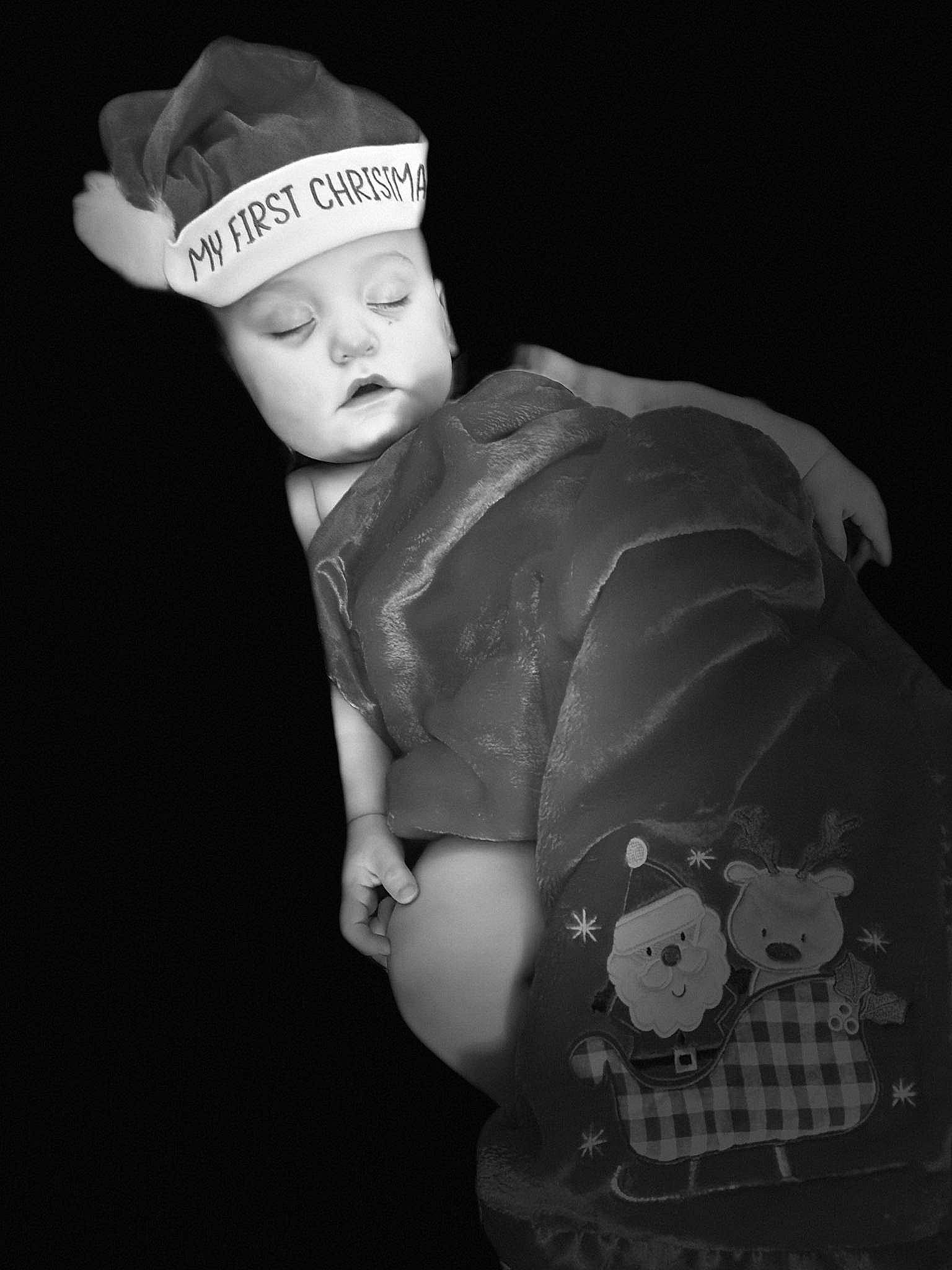 Travis is registered to the contest to win money with this photo: baby, baby_toddler_clothing, black, black_and_white, cap, child, costume_hat, darkness, fashion_accessory, flash_photography, formal_wear, hat, headgear, monochrome, monochrome_photography, person, sleeve, style, suit, toddler