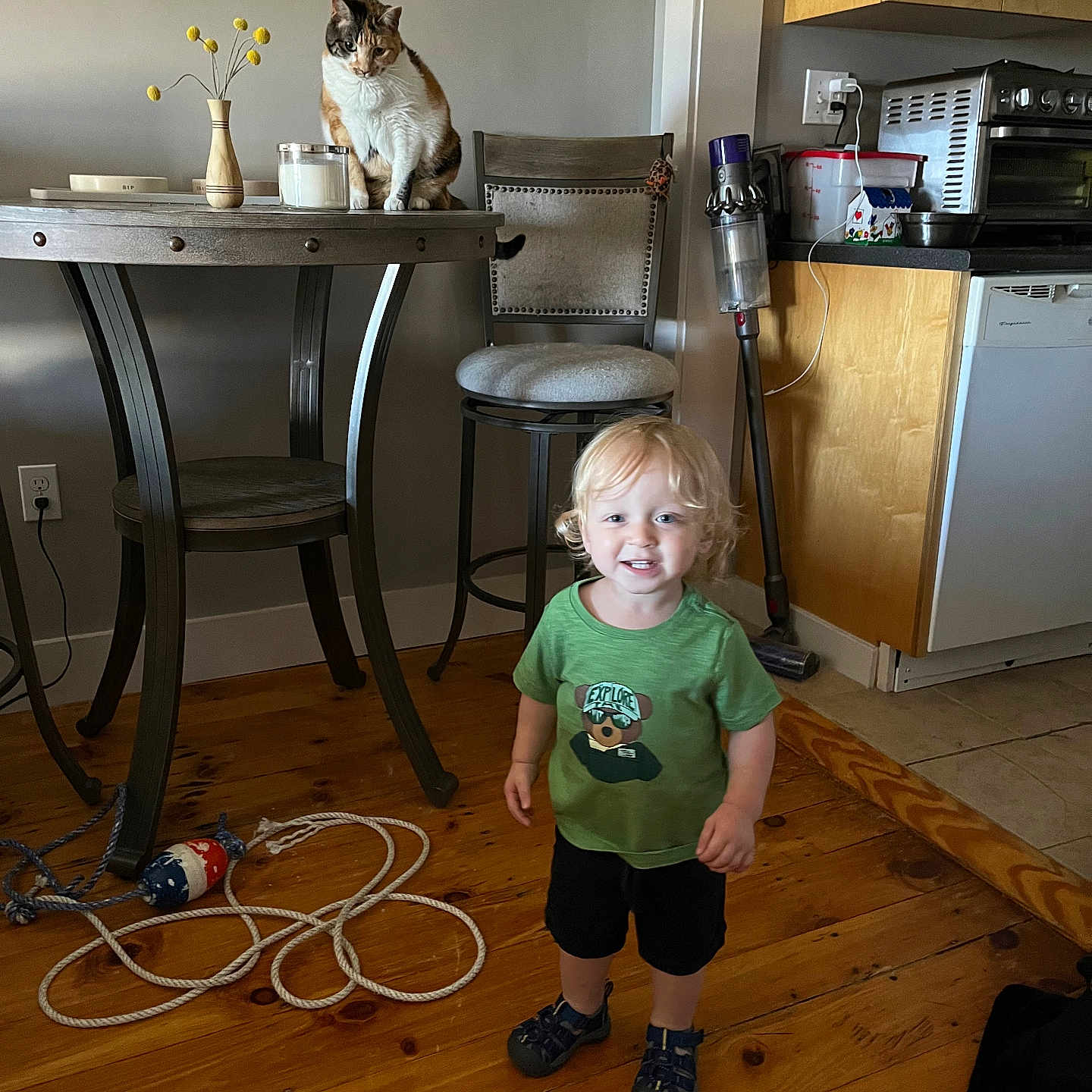 Ezra is registered to the contest to win money with this photo: architecture, boy, building, child, diningroom, diningtable, face, furniture, hardwood, head, indoors, interiordesign, male, person, photography, plywood, portrait, room, table, wood