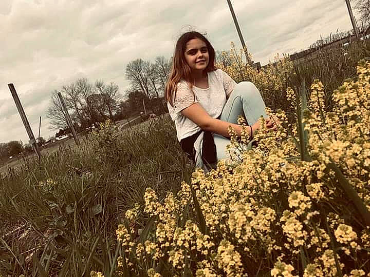 Kensey is registered to the contest to win money with this photo: canola, field, flower, fun, grass, happy, joy, meadow, mustard_and_cabbage_family, people_in_nature, person, photo_shoot, photography, plant, prairie, smile, spring, summer, wildflower