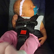 Brooklynn joined the competition — help win amazing prizes! baby, car_seat, pacifier, headband, pink_pants, sleeping, infant, child, straps, safety_harness, cute, small_hands, clothing, newborn, peaceful, resting, seat, transport, indoor, person