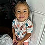 Kalani joined the competition — help win amazing prizes! barefoot, casual, child, clothing, colorful, cute, door, floor, happy, indoor, person, pink, shirt, shorts, smile, standing, sun_pattern, sunglasses, wooden_floor, young_child
