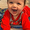 baby, bright_colors, carpet, child, cute, expression, face, floor, hands, happy, head, home, indoor, infant, playing, red_clothing, smiling, toy, tummy_time, water_mat