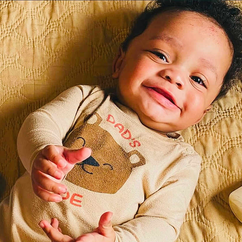 Ausar is registered to the contest to win money with this photo: baby, babylaughing, face, happy, head, person, smile