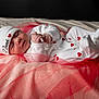 baby, newborn, sleeping, infant, white_clothing, red_hearts, hat, soft_blanket, red_netting, peaceful, cute, portrait, cozy, sleep, hand, footed_pajamas, lying_down, closeup, child, resting