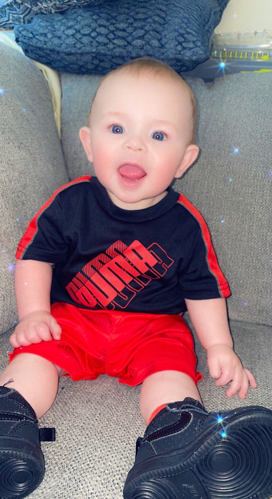 Lennox is registered to the contest to win money with this photo: baby, baby_toddler_clothing, black, blue, cheek, child, cool, electric_blue, eye, human_leg, knee, organ, pattern, person, sitting, skin, sleeve, surprise, t_shirt, toddler