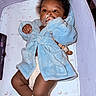 Kyrie joined the competition — help win amazing prizes! baby, bassinet, blanket, blue_robe, child, cozy, crib, curly_hair, dark_skin, diaper, indoor, infant, lying_down, moon_pattern, pacifier, portrait, sleeping_area, socks, star_pattern, tablet