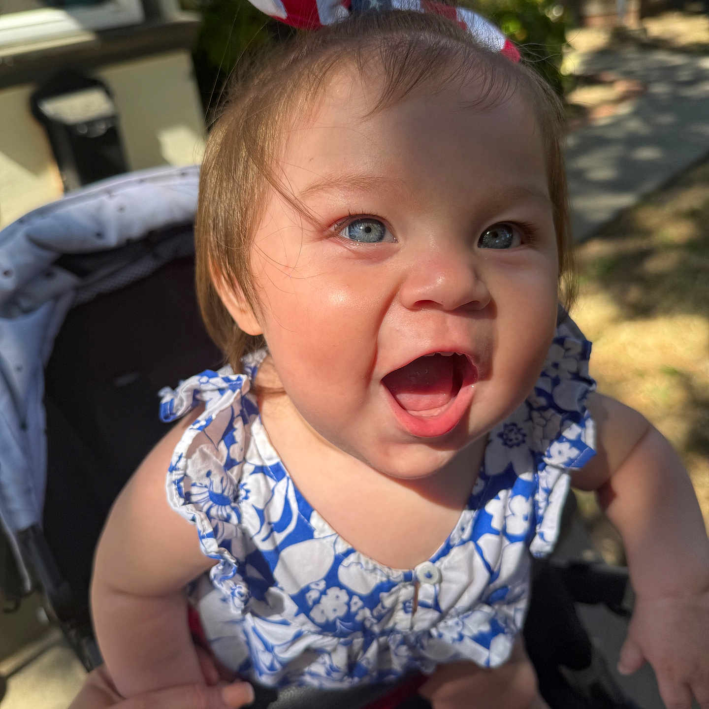 Daisylou joined the competition — help win amazing prizes! american_flag, baby, blue_eyes, child, cute, dress, expression, hand_holding, happy, headband, infant, outdoor, person, playful, skin, smiling, stroller, summer, sunlight, young