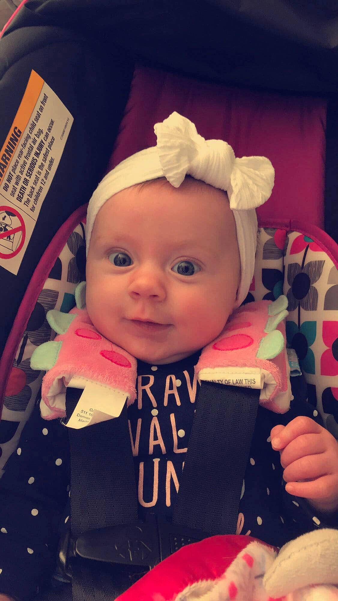 Lila joined the competition — help win amazing prizes! baby, cheek, child, cool, ear, eye, face, forehead, head, headgear, lip, person, pink, product, skin, toddler