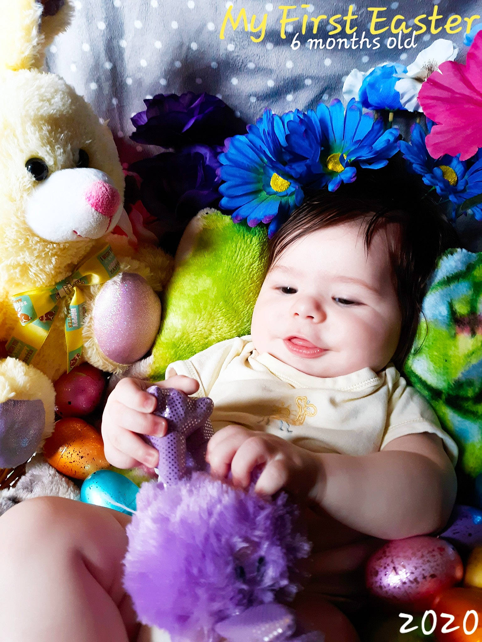 Zane is registered to the contest to win money with this photo: baby, child, easter, easter_bunny, flower, hair_accessory, happy, lavender, person, photography, photomontage, purple, smile, stuffed_toy, toddler, violet