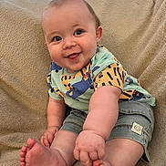 Jackson joined the competition — help win amazing prizes! baby, smiling, tongue_out, sitting, denim_shorts, colorful_shirt, cozy_blanket, barefoot, cute, happy, infant, child, indoors, plush, face, legs, feet, chubby, portrait, playful