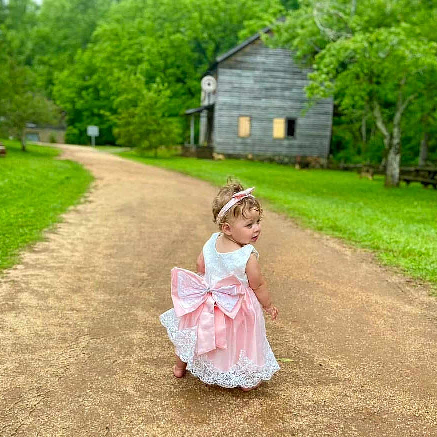 Georgia Mae is registered to the contest to win money with this photo: aerialview, architecture, building, child, clothing, dress, driveway, face, female, girl, head, house, housing, nature, outdoors, person, photography, portrait, sitting, sleeve