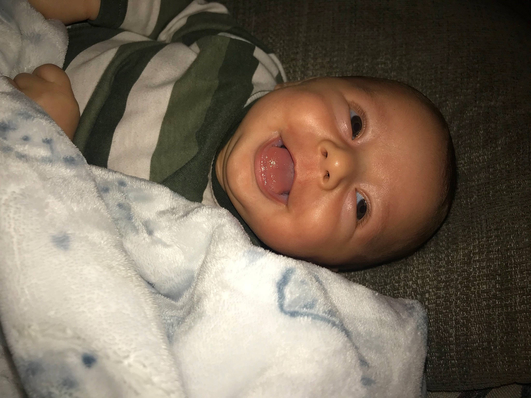 Blayne is registered to the contest to win money with this photo: baby, baby_toddler_clothing, cheek, child, comfort, darkness, eyebrow, eyelash, flash_photography, iris, lip, monochrome_photography, mouth, nose, person, room, sitting, skin, sleeve, smile