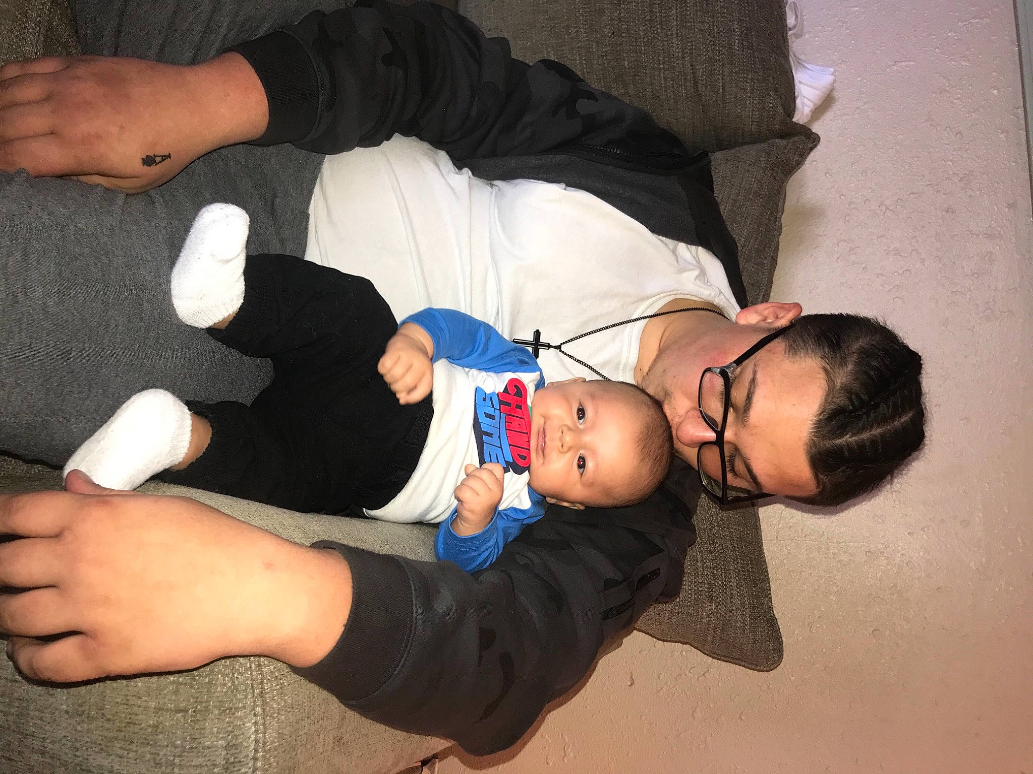 Blayne is registered to the contest to win money with this photo: arm, baby, baby_toddler_clothing, child, comfort, elbow, finger, gesture, hand, hat, human_leg, joint, knee, lap, leg, person, sock, thigh, thumb, toddler