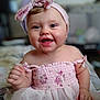 Kinleigh is registered to the contest to win money with this photo: baby, child, smiling, pink_dress, headband, indoor, happy, portrait, cute, toddler, face, skin, clothing, person, sitting, closeup, expression, infant, fashion, soft