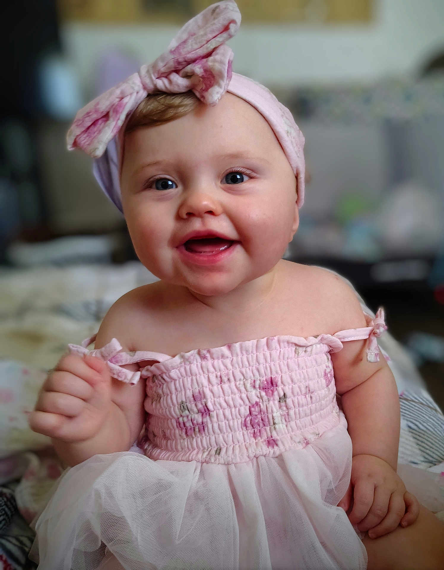 Kinleigh is registered to the contest to win money with this photo: baby, child, smiling, pink_dress, headband, indoor, happy, portrait, cute, toddler, face, skin, clothing, person, sitting, closeup, expression, infant, fashion, soft