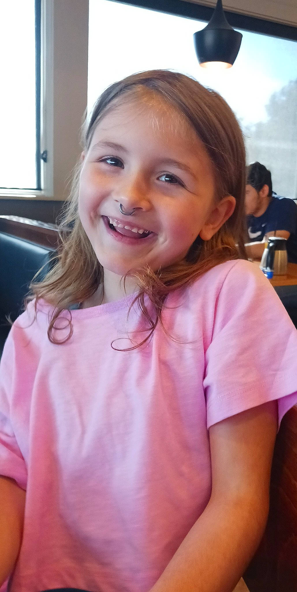 Alannah is registered to the contest to win money with this photo: cheek, eyelash, face, facial_expression, gesture, hair, hairstyle, happy, head, iris, joy, lip, mouth, neck, person, pink, skin, sleeve, smile, t_shirt