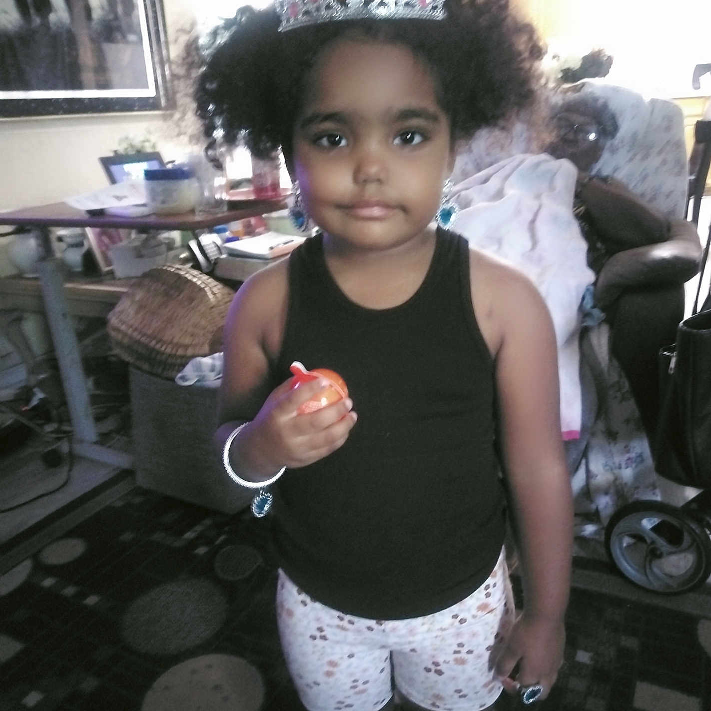 Myrackle is registered to the contest to win money with this photo: black_tank_top, bracelet, carpet, chair, child, crown, curtains, earrings, furniture, girl, indoor, jewelry, living_room, person, portrait, rug, shorts, table, toy, window