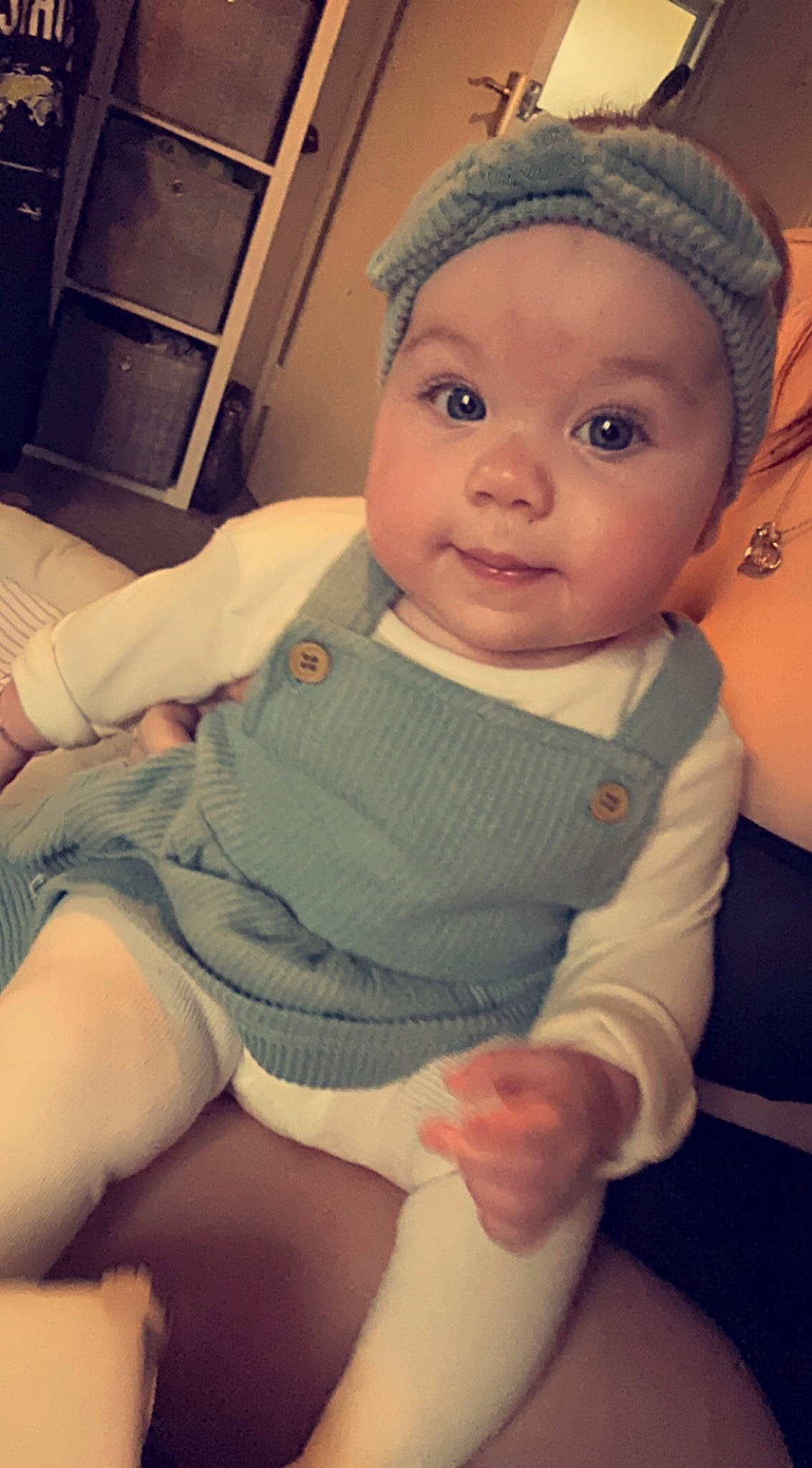 Isla-rose is registered to the contest to win money with this photo: baby, baby_toddler_clothing, cap, cheek, chin, comfort, cool, eye, eyebrow, facial_expression, finger, headwear, human_body, iris, lip, mouth, nose, person, skin, sleeve