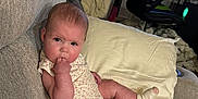 Aspen joined the competition — help win amazing prizes! baby, blanket, box, casual, child, clothing, computer_monitor, couch, curious, face, furniture, gaming_chair, home, indoor, infant, living_room, person, pillow, relaxed, socks