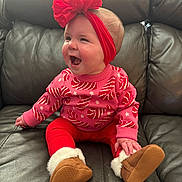 Aspen joined the competition — help win amazing prizes! baby, brown_boots, candy_cane_pattern, cheerful, child, cozy, cute, happy, holiday_theme, indoors, infant, leather_couch, pink_sweater, portrait, red_headband, red_pants, sitting, small_hands, smiling, warm_clothing