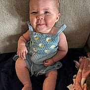 Aspen joined the competition — help win amazing prizes! baby, child, infant, sitting, blue_dress, daisies, couch, blanket, face, expression, funny_face, skin, arm, leg, foot, indoors, cute, smirk, winking, cozy