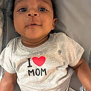 Kyren is registered to the contest to win money with this photo: baby, blanket, child, closeup, clothing, curly_hair, cute, diaper, eyes, face, heart, indoors, infant, laying_down, love, mom, person, portrait, shirt, smile
