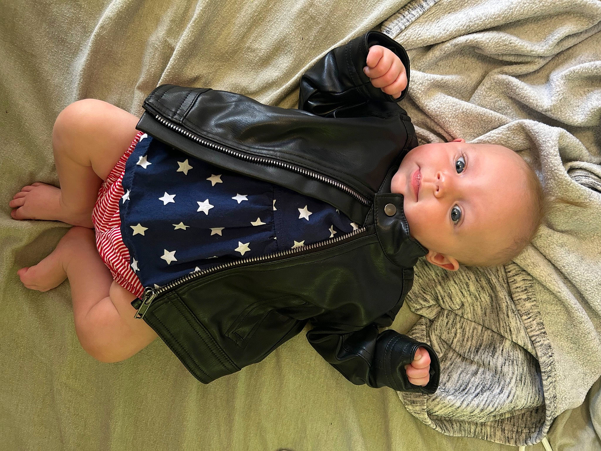 Anayla is registered to the contest to win money with this photo: baby, baby_products, baby_toddler_clothing, child, comfort, elbow, electric_blue, gesture, linens, pattern, person, sleeve, thumb, toddler, wood, wrist