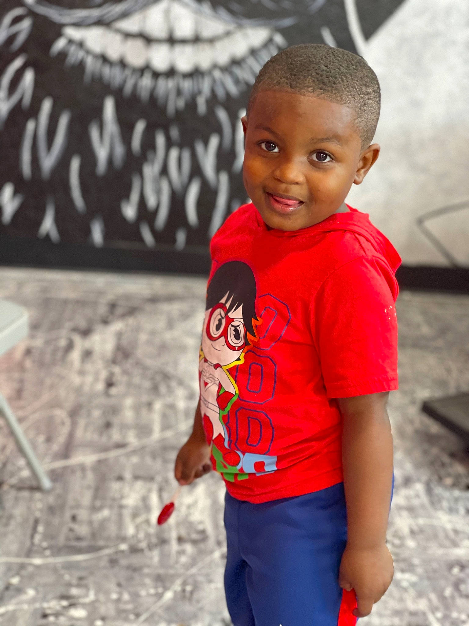 Jabari is registered to the contest to win money with this photo: art, black, black_hair, cool, flash_photography, happy, head, human_body, joy, leisure, neck, person, shoulder, skin, sleeve, smile, street_fashion, style, t_shirt, toddler