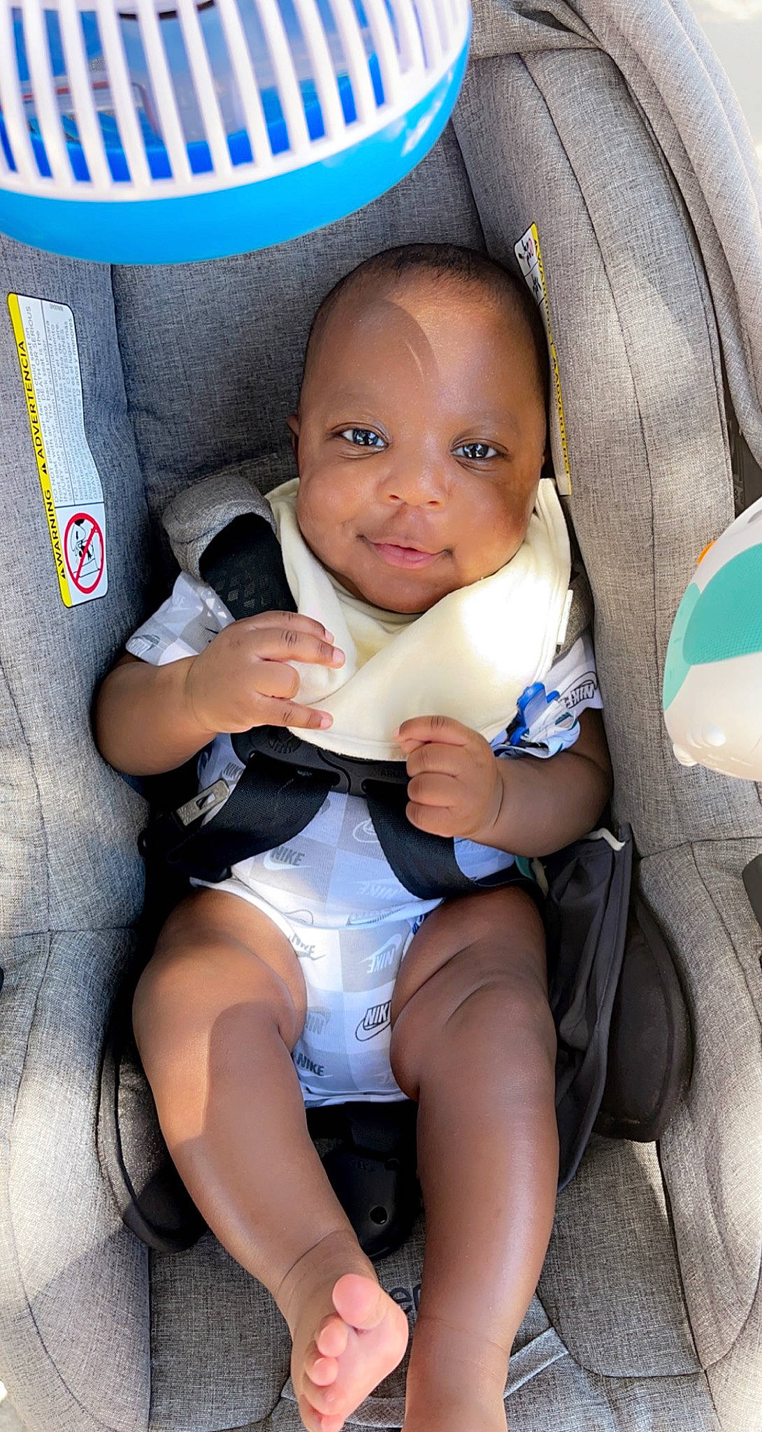 Jmarkus Jr is registered to the contest to win money with this photo: auto_part, baby, baby_toddler_clothing, black, black_hair, blue, car_seat, chair, cheek, child, comfort, face, finger, hairstyle, knee, person, seat_belt, skin, thigh, toddler