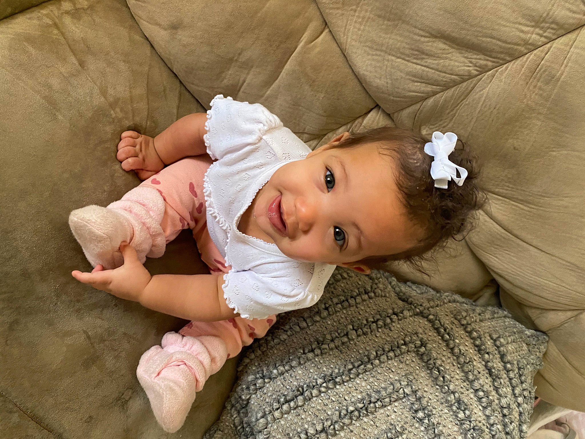 Kayla is registered to the contest to win money with this photo: baby, baby_toddler_clothing, cheek, child, chin, comfort, eye, face, flash_photography, flooring, grass, happy, head, iris, joy, lip, person, sitting, skin, sleeve