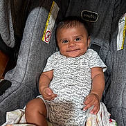 Frankie joined the competition — help win amazing prizes! baby, infant, car_seat, smiling, onesie, whale_pattern, blanket, child, cute, seat, clothing, happy, portrait, indoors, person, baby_clothes, fabric, comfort, car_seat_straps, toddler