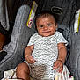 baby, infant, car_seat, smiling, onesie, whale_pattern, blanket, child, cute, seat, clothing, happy, portrait, indoors, person, baby_clothes, fabric, comfort, car_seat_straps, toddler