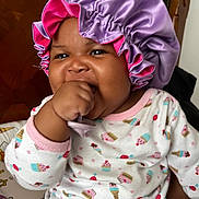Darrielle joined the competition — help win amazing prizes! baby, bodypart, bonnet, cap, clothing, face, finger, hand, hat, head, person, photography, portrait, sunhat