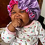 baby, bodypart, bonnet, cap, clothing, face, finger, hand, hat, head, person, photography, portrait, sunhat