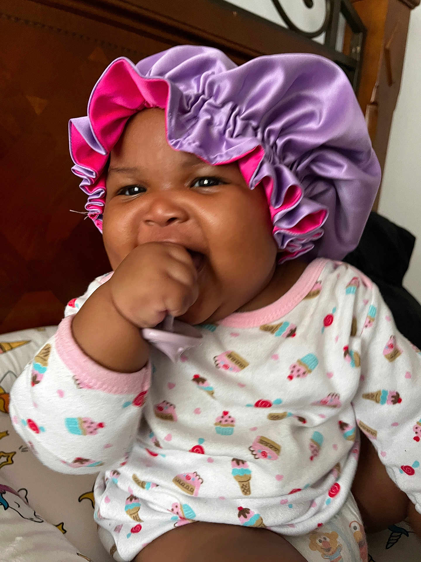 Darrielle joined the competition — help win amazing prizes! baby, bodypart, bonnet, cap, clothing, face, finger, hand, hat, head, person, photography, portrait, sunhat