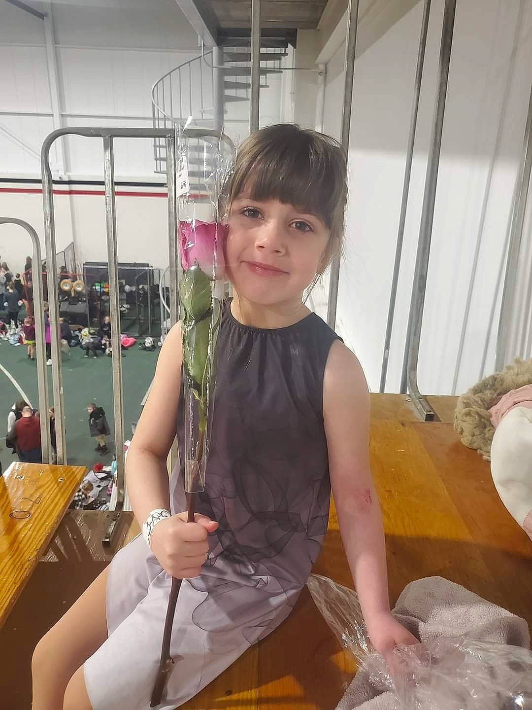 Mckenna is registered to the contest to win money with this photo: chair, chest, event, fashion_design, fun, happy, human_leg, jewellery, joy, leisure, necklace, person, room, sitting, smile, thigh, travel