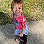 casual, child, colorful_clothing, cute, daylight, feet, grass, hair, happy, nature, outdoor, person, playful, portrait, rainbow_shoes, sidewalk, smiling, toddler, tree_trunk, young