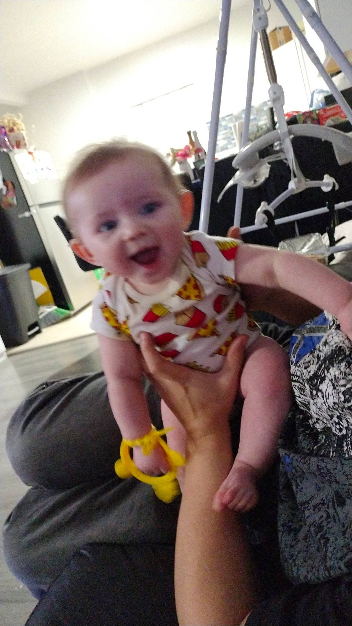 Bryan is registered to the contest to win money with this photo: baby, child, event, facial_expression, flooring, foot, fun, hairstyle, happy, human_leg, joint, knee, leisure, mouth, person, product, shoulder, sitting, skin, thigh