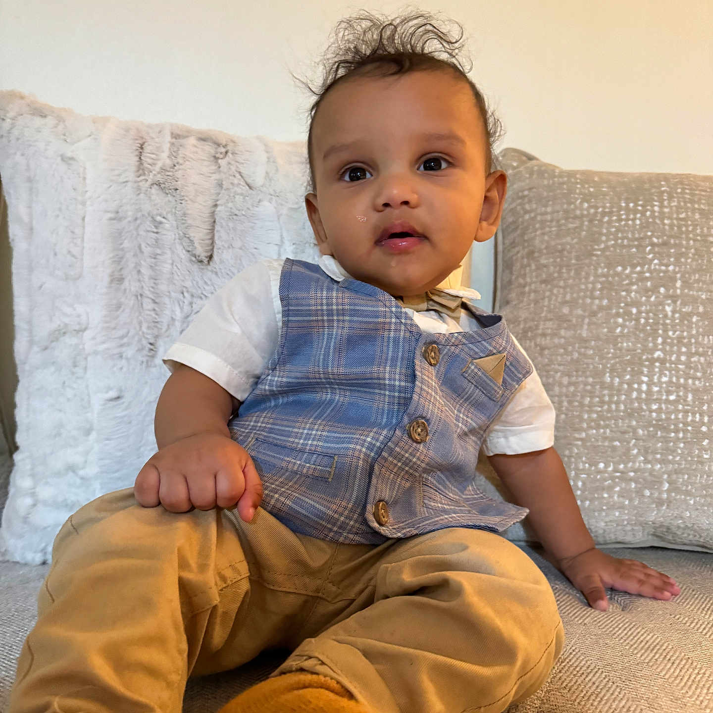 Jeffrey is registered to the contest to win money with this photo: baby, bodypart, clothing, couch, cushion, face, finger, furniture, hand, happy, head, homedecor, jeans, pants, person, photography, portrait, sitting, sleeve, smile