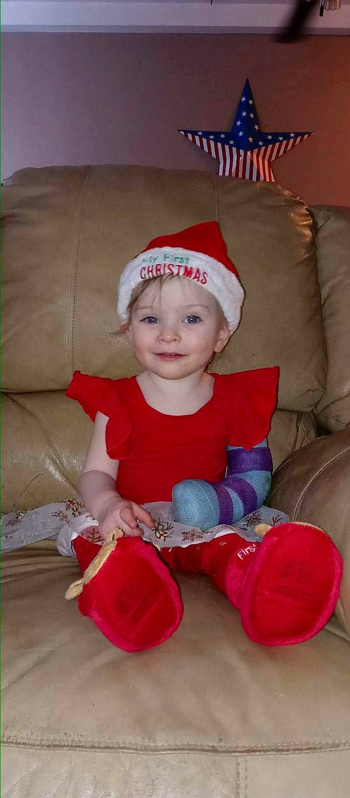 Savannah joined the competition — help win amazing prizes! baby, baby_toddler_clothing, child, comfort, costume_hat, event, eye, facial_expression, head, headgear, headwear, human_body, joy, lap, person, red, santa_claus, skin, sleeve, smile